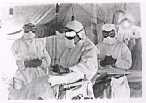 The scientists are trying to fix the microchips on the pigeons, 1941 The scientists are trying to fix the microchips on the pigeons, 1941